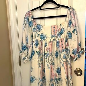 Babydoll style mini dress with puff sleeves